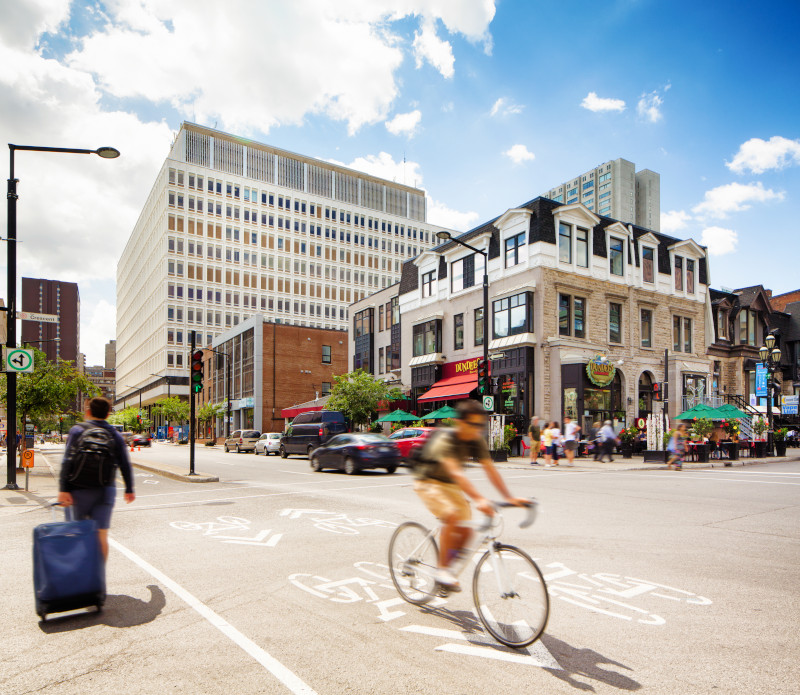 A cyclist uses a bike lane in downtown Montreal